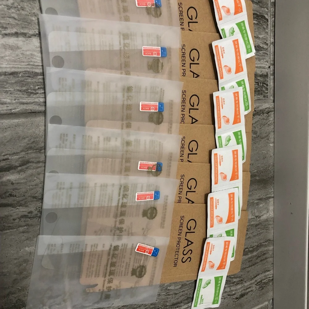 Six pack of iPhone 5s glass screen protectors with wipes to clean phone & screen